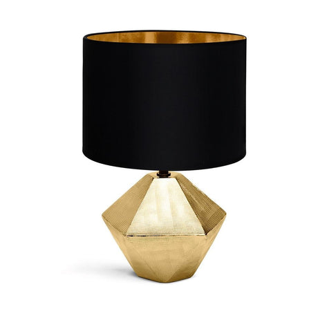 Edle goldfarbene Tischlampe aus Keramik mit 6-eckigem Fuss und schwarzem Stoffschirm.