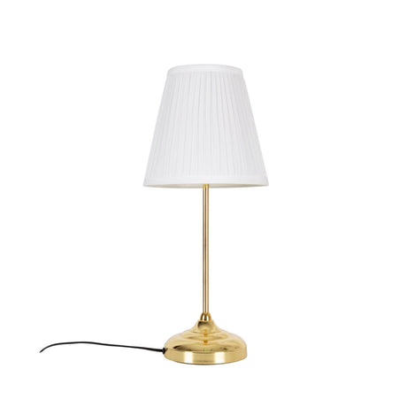 Edle Tischleuchte mit goldenem Fuß und raffiniertem Stoffschirm.