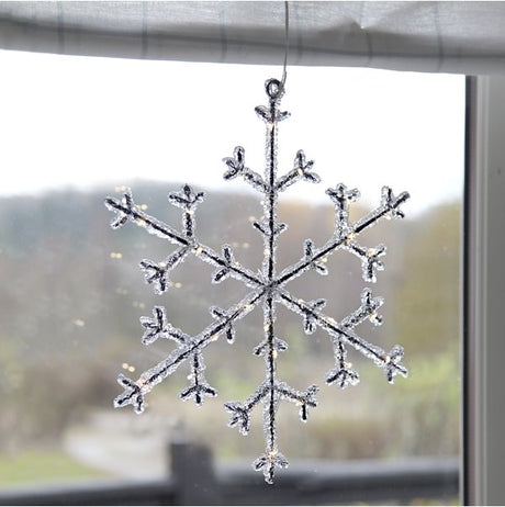 Schöne dekorative Schneeflocke in warmweiß, 3 x AA Batterie, 27 cm Durchmesser  Lichttechnik24.de.